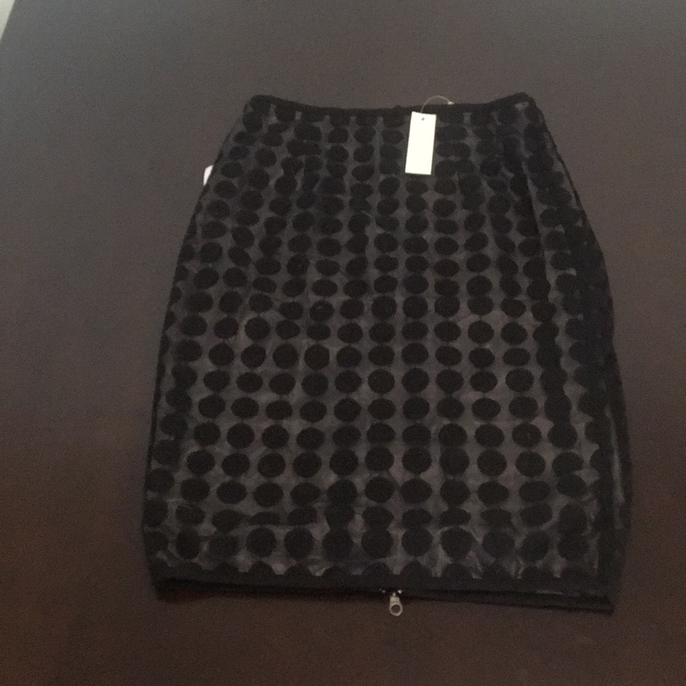 Black polka dot knee length skirt